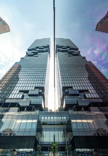 Low-angle view of the King Power Mahanakhon building reflected in a window, Bangkok, Thailand, Asia