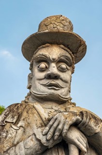 Chinese stone doll, Gate gaurdian at Wat Pho complex, Bangkok, Thailand, Asia