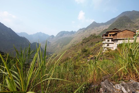 Traditional house and view of northern mountain landscape, Ha Giang province, Vietnam, Asia