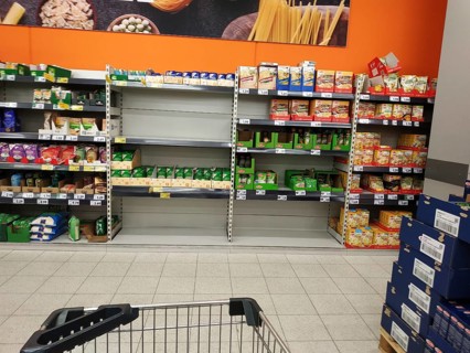 Rice shelves in a supermarket emptied by supply shortages and hoarding purchases