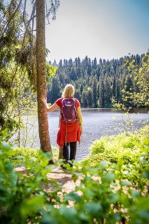 Hiker woman standing by the lake, Glaswaldsee, Bad Ripoldsau, Germany, Europe