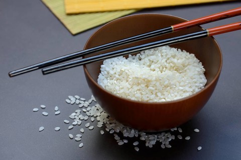 Rice, white rice in bowl with wooden ladle, uncooked