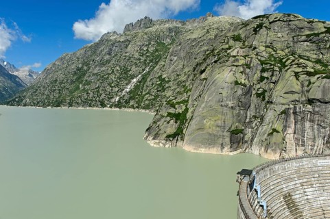 The well-filled Grimselsee reservoir with the Spitallamm wall, Guttannen, Canton Bern, Switzerland,