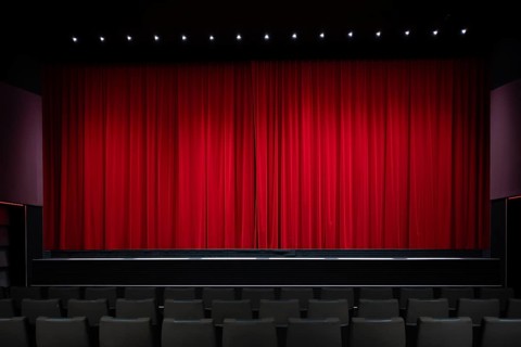 Interior shot, red velvet curtain in a cinema, theatre, rows of seats, Stuttgart,