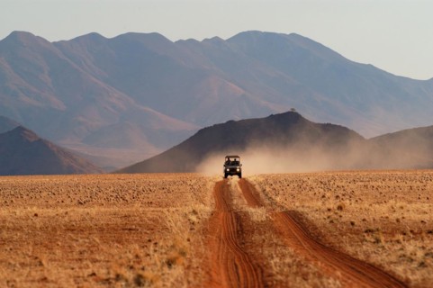 A jeep in the landscape, Namibia, Africa