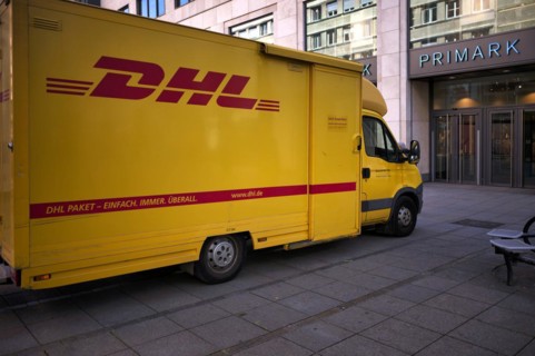 DHL delivery vehicle, logo, parked in front of Primark department stores' chain, KönigsstraÃŸe,