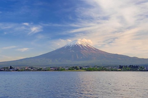 Mount Fuji in spring, active stratovolcano showing volcanic cone seen from across Lake Sh? ji on