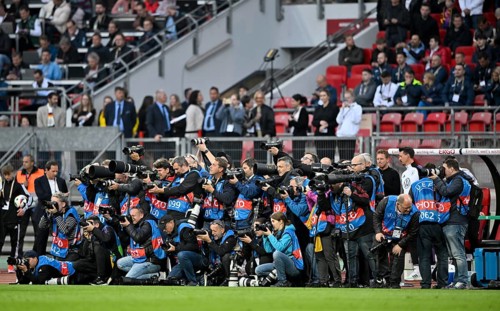 Crowd of press photographers, many sports photographers, UEFA jerseys, international match, Max