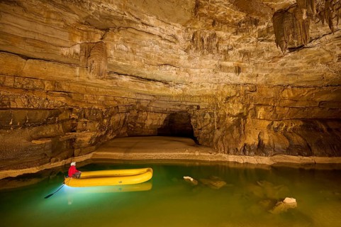 Karst cave, lake, rubber dinghy, speleologist, Krizna jama, Cerknica, Carniola, Slovenia, Europe