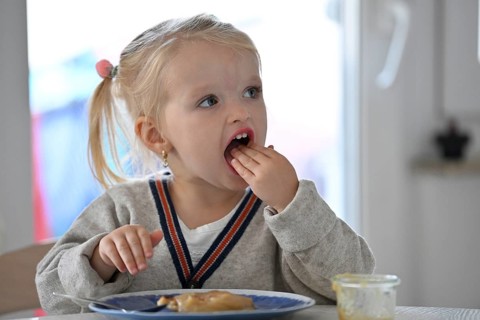 Little girl, 2 years, blonde, eats pancakes, pancake, plate, spoon, eat, Stuttgart,