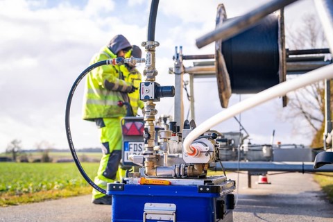 Detailed view of a machine with hoses and valves on a blue crate, fibreglass construction, Nagold,