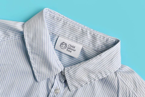 Clothing label with text saying 'Child labour free'