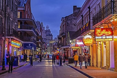 Bars and pizza restaurants at night in Bourbon Street, French Quarter, Vieux Carré in the city New