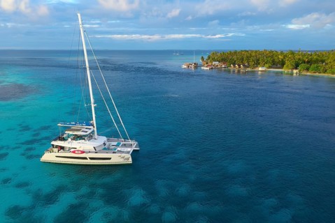 Aerial view, diving ship Aqua-Tiki III, catamaran, aft South Pass, South Channel and Tetamanu