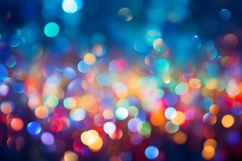 An abstract and colorful defocused blurred bokeh background with bright lights and festive