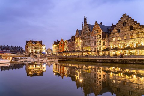 Medieval guild houses of Graslei Kai on the river Leie at dusk, Ghent, Belgium, Europe