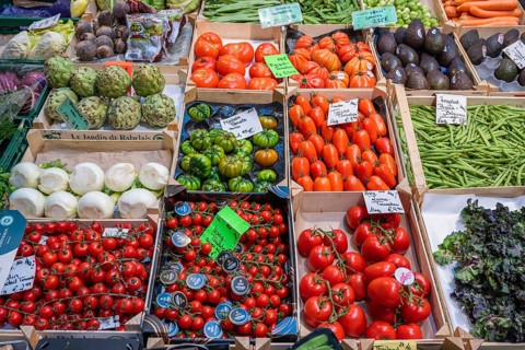 Market stall with a wide range of local and exotic vegetables in the Markthalle Stuttgart,