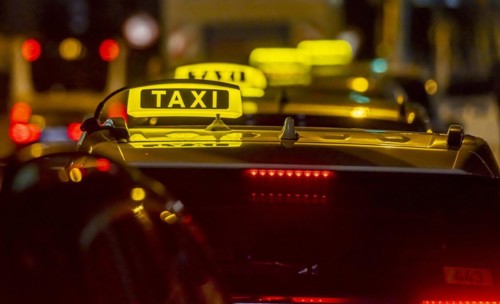 Illuminated taxi sign in the evening, symbolic photo, Stuttgart, Baden-Württemberg, Germany, Europe