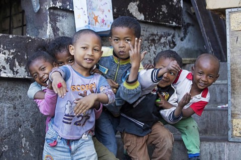Smiling Malagasy children having fun posing in the streets of Antananarivo, capital city of