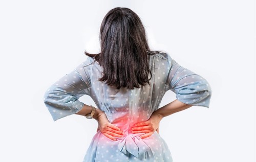 Girl with spine problems isolated. Woman with back pain on isolated background. lumbar problems