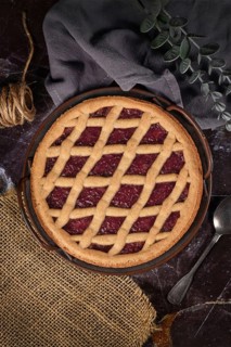 Top view of homemade pie called 'Linzer Torte', a traditional Austrian shortcake pastry topped with