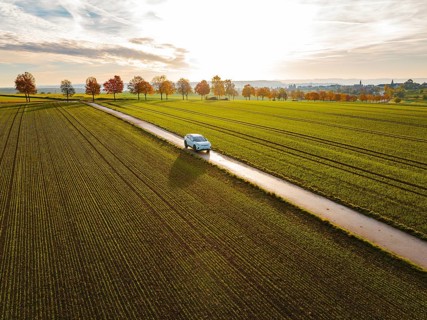 Aerial view of a VW ID4 electric car at sunrise in autumn, Herrenberg, Germany, Europe