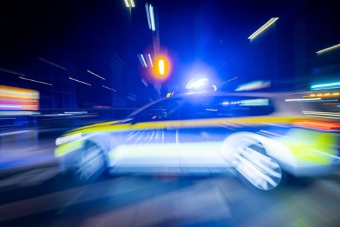 A police vehicle in action, with blue light switched on, Dresden, Saxony, Germany, Europe