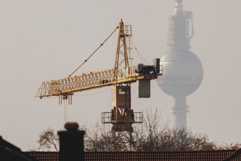 A crane looms in front of the Berlin television tower in Berlin, 29/02/2024