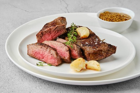 Beef strip steak medium rare on a plate