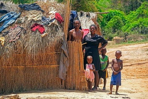 Malagasy family with children posing at their hut at Begidro near Ankiliroroka, Belo sur
