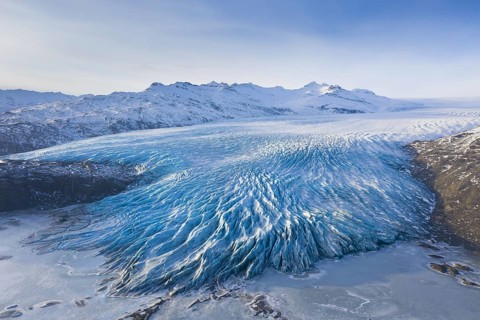 Aerial view over ice tongue Falljökull in winter, one of many outlet glaciers of Vatnajökull, Vatna