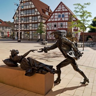Sleeping Beauty sculpture by Karin Bohrmann-Roth in the old town, fairy tale based on the Brothers