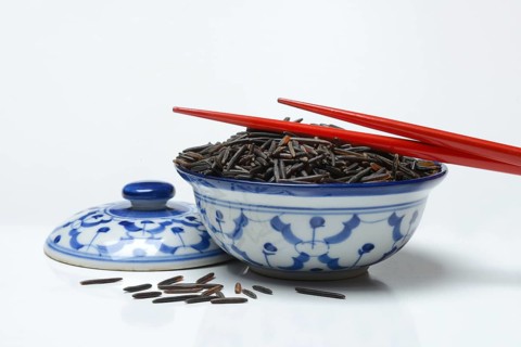 Rice, black wild rice in bowl with chopsticks, Canada, North America