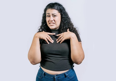 Young woman disgusted face isolated. Displeased young woman frowning on isolated background. People