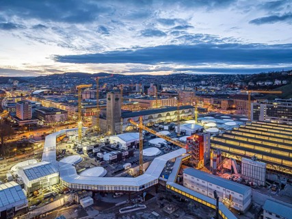 Central station, Stuttgart 21 construction site, the city centre above. The new through station is