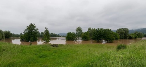 Symbolic image extreme weather, global warming, climate change, flood retention basin, flood
