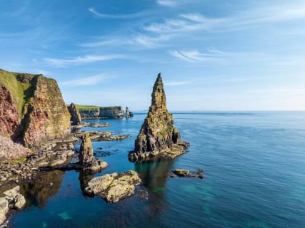 Aerial view of the rugged coastal landscape with the Duncansby Stacks, Duncansby Head coast, County