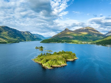 Aerial view of the western part of the freshwater loch Loch Leven with the historic island of
