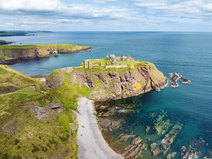Aerial view of Dunnottar Castle ruins on the North Sea coast, Stonehaven, Aberdeenshire, Scotland,