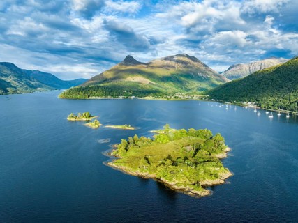 Aerial view of the western part of Loch Leven with the historic island of Eilean Munde, above it