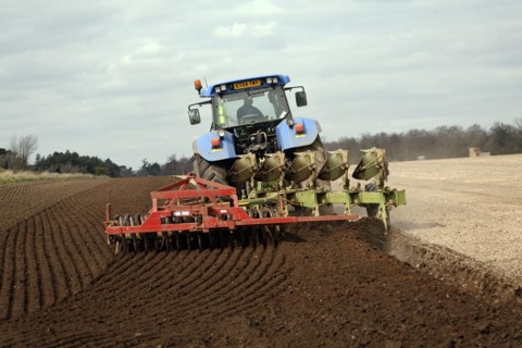 New Holland tractor disc harrowing field, Sutton, Suffolk, England, United Kingdom, Europe
