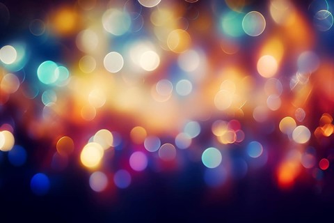 An abstract and colorful defocused blurred bokeh background with bright lights and festive