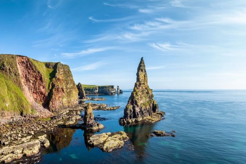 Aerial view of the rugged coastal landscape with the Duncansby Stacks, Duncansby Head coast, County