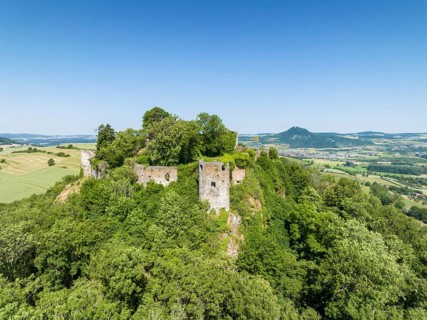 Aerial view of the Hegau volcano and the ruins of MÃ¤gdeberg castle, on the horizon the Hohenhewen,