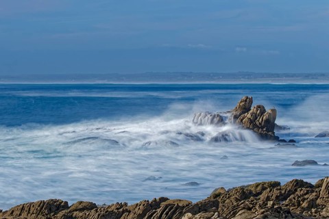 The waves of the Atlantic wash over the rocks on the coast off Penmarch in Brittany. Finistere,