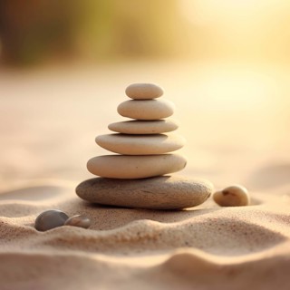 Zen stones stack on sand waves in a minimalist setting for balance and harmony. Balance, harmony,
