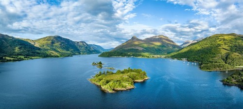 Aerial panorama of the western part of the freshwater loch Loch Leven with the historic island of