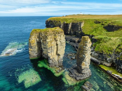Aerial view of rock towers, surf pillars on the North Sea coast near Wick, County Caithness,