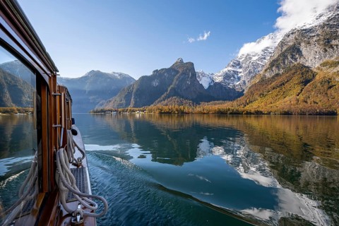 Tourist boat on the Königssee, Watzmann massif, autumnal mountain landscape reflected in the lake,