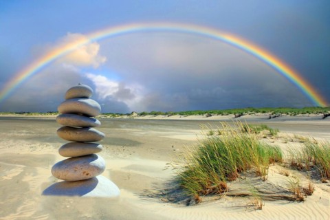 Pebble tower on the beach of the island of Borkum, rainbow, island of Borkum, Lower Saxony, Federal